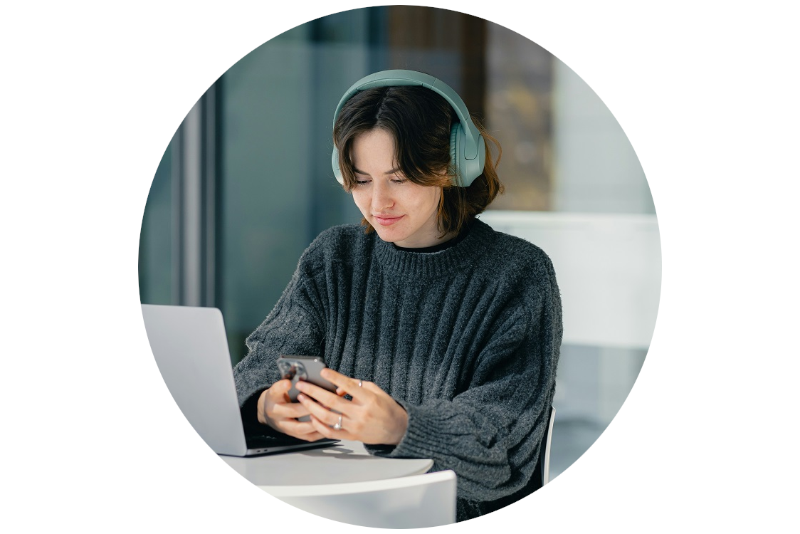 girl on&nbsp;phone with headphones