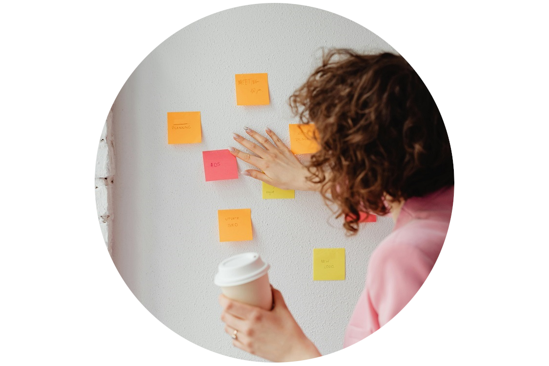woman holding a&nbsp;cup of coffee making marketing strategy
